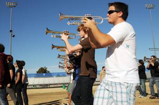 Green Valley High School marching band members Andrew Avanessian, right, and Sam Shields, center, practice Thursday. The Green Valley High School marching band is performing at the inauguration of President-elect Barack Obama.