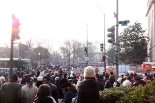 People gather on the streets of Washington, D.C. to catch a glimpse of newly sworn-in President Barack Obama Tuesday.