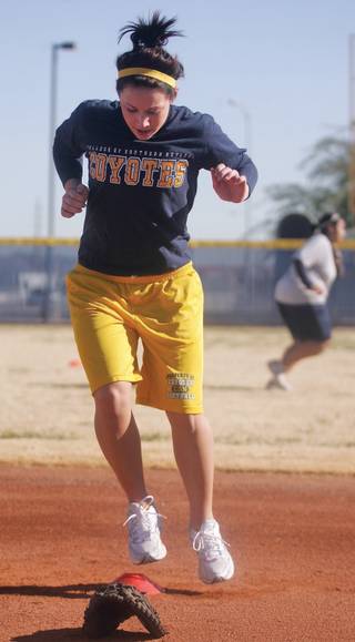 CSN's Tiffany Parker jumps from side to side during conditioning drills at CSN's softball practice at Russell Road Softball Park on Jan. 12.  
