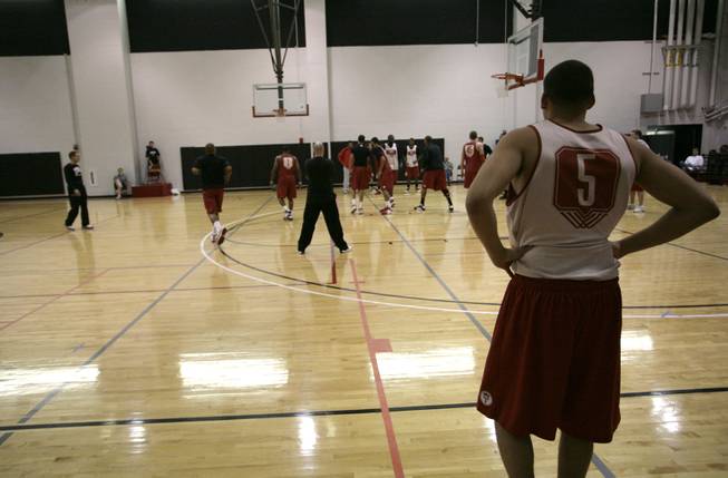 UNLV guard Derrick Jasper watches his teammates run through practice drills at the Cox Pavilion. He, along with UCLA transfer Chace Stanback and a solid incoming freshman class, will be responsible for carrying on what current seniors Wink Adams, Joe Darger and Rene Rougeau built under Lon Kruger.