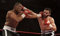 Former UNLV boxer Henry Namauu, left, battles with Erick Vega of Phoenix during the fifth round of a cruiserweight fight at the Orleans on Friday. Namauu won the six-round bout by unanimous decision.