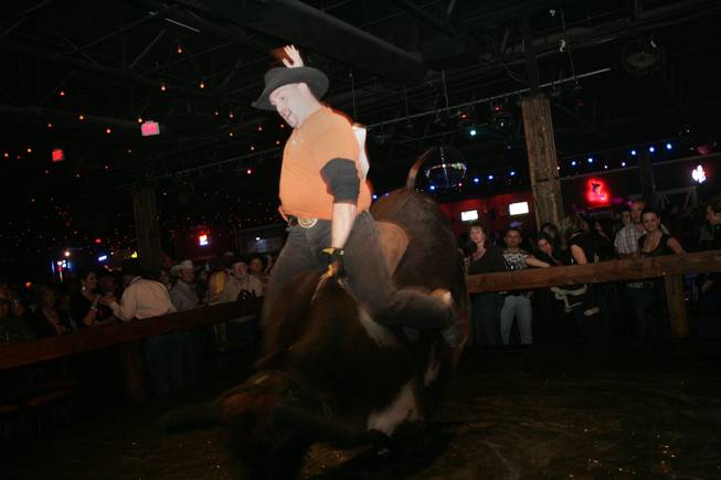 Charles Musselman competes in the mechanical bull riding contest Man vs. Machine Thursday at Stoney's Rockin' Country, 9151 Las Vegas Blvd.