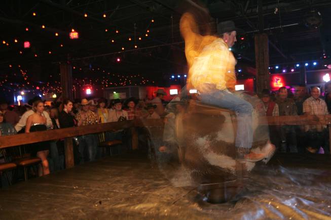 Silverado resident Charles Brumit competes Thursday in the mechanical bull riding contest Man vs. Machine at Stoney's Rockin' Country, 9151 Las Vegas Blvd.
