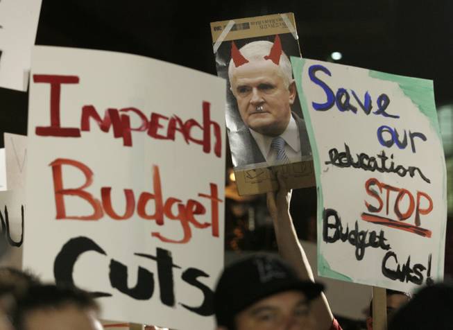 Many of the signs students carried at Thursday's rally were critical of Gov. Jim Gibbons, who included a 36 percent cut in funding for higher education in his proposed budget. 