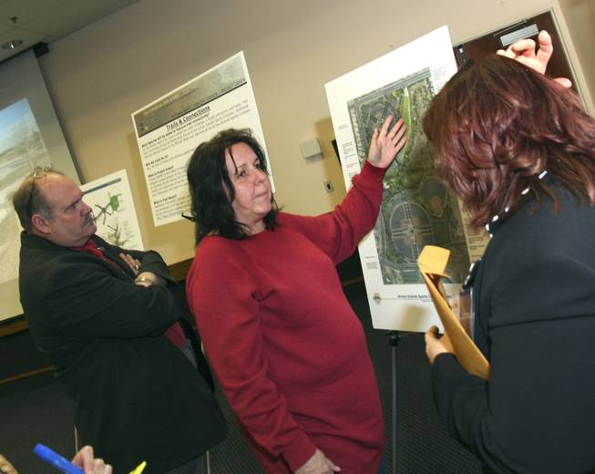 Wanting to make it clear they are not "dog haters," David Flatt, left, and Martine Jordan, center, had questions for Park Project Manager Patricia Ayala at Thursday's neighborhood meeting about the Arroyo Grande Sports Complex at the Henderson Convention Center.