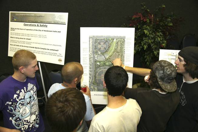 A group of bike enthusiasts study an Arroyo Grande Sports Complex map. Several of those in attendance at Thursday's meeting said they were excited about having a new place to ride.