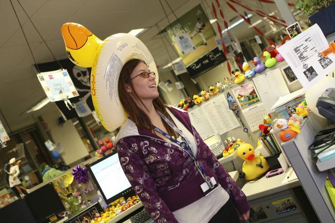 Known as the "Queen of Ducks," Zappos.com employee Stacy Hardy models a duck hat she received from a coworker.