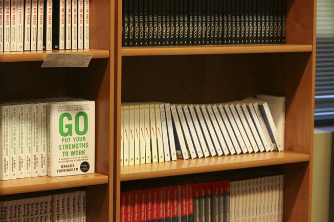 Motivational and inspirational business books sit on shelves available free of charge to employees, vendors and guests at the corporate offices of Zappos.com in Henderson.