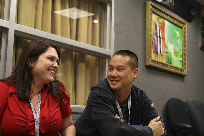 Human Resources assistant and "cruise ship manager" Jamie Naughton laughs with CEO Tony Hsieh during a meeting at the corporate offices of Zappos.com in Henderson. The company stays away from serious job titles.