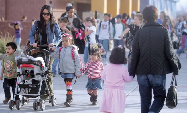 From left to right, Andre, Kathleen, Aleza and Ariana Aragones walk home from Linda Givens Elementary School. Givens is one of nine Summerlin schools that might go from a nine-month to a year-round schedule to alleviate crowding.