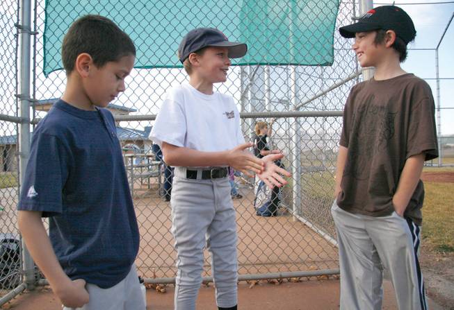 Nine-year-olds Gabriel Lawrence, Jacke Hubel and Vinny Mayo talk about trying out for the Boulder City Little League at the Veteran's Memorial Park on Jan. 24. 