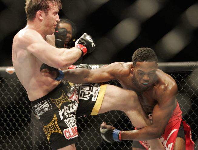 Jon Jones, right, attempts a punch at Stephan Bonnar. Jones kept his record perfect by defeating Bonnar by unanimous decision