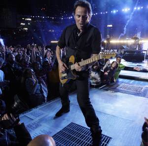 Bruce Springsteen, center, performs during the halftime of the NFL Super Bowl XLIII football game between the Arizona Cardinals and the Pittsburgh Steelers, Sunday, Feb. 1, 2009, in Tampa, Fla. 