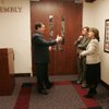 State senators, from left, Warren Hardy, R-Las Vegas, Maggie Carlton, D-Las Vegas, and Allison Copening, D-Las Vegas, wait outside the Assembly chamber to ceremonially inform them that the Senate is "organized and ready for business" on the first day of the 2009 legislative session Monday in Carson City.  