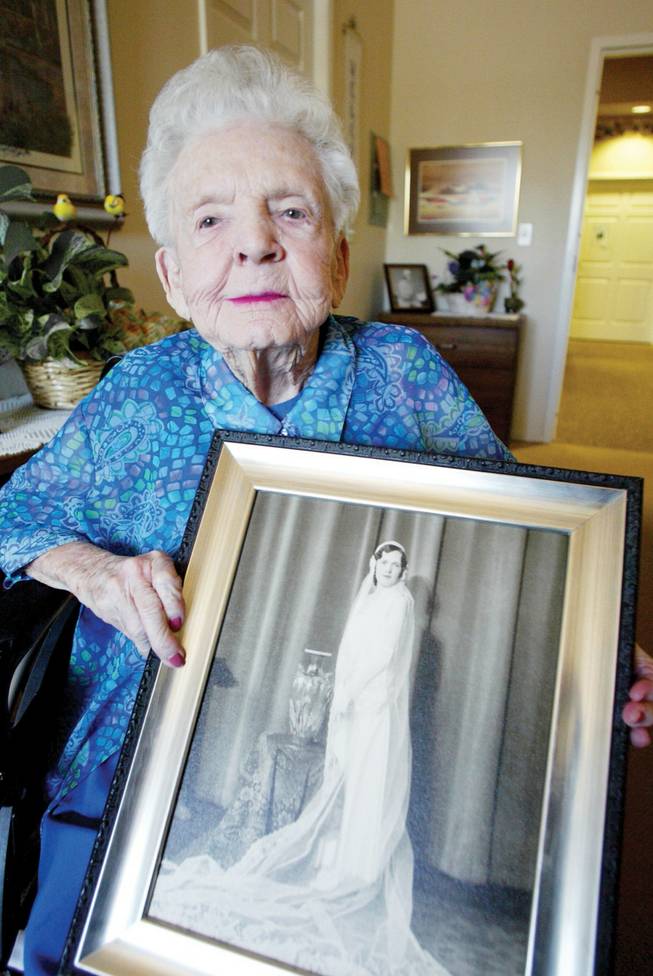 Mary Eaton, who died Saturday, holds her wedding photo in this photo from last year.