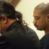 Emmanuel Dozier, who is charged with shooting police officers during a SWAT raid on his house Dec. 23, sits through a preliminary hearing Jan. 20 at the Henderson Justice Court.
