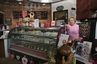 Laid-off employee Sharon Pritchard volunteers her time 10 hours a week to work behind the counter of Cheesecake and Crime, a mystery book shop and cheesecake joint, due to her dedication to her employers, Pam and Lendall Mains.