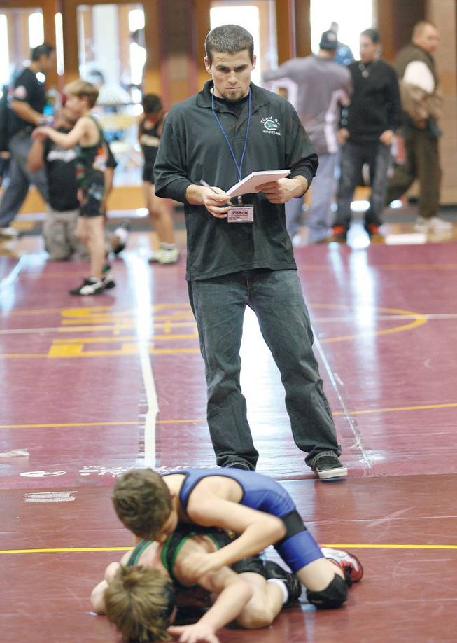 Green Valley wrestling coach Jake Rollans looks on during the Crusader Invitational Wrestling Tournament at Faith Lutheran High School on Jan. 31.