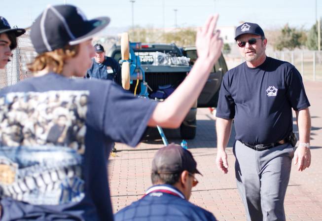 The Vegas Valley Umpires Association umpire Dave Ruegge guides 17-year-old Matt Kerstine in the association's weekly umpire clinics at the Russell Road Park Jan. 31. 