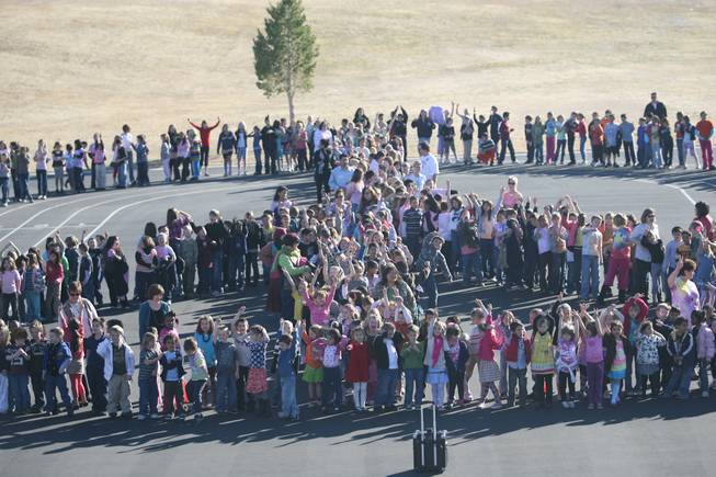Students at J. Marlan Walker International School showed off their solidarity during a display Jan. 30, where the entire school made its way to the playground to form a human peace sign.