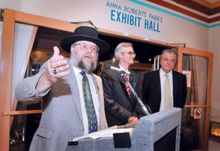 Mark Hall-Patton, left, administrator for the Clark County Museums, speaks before the opening of the Clark County Centennial exhibit at the museum Thursday. Clark County Commissioners Rory Reid and Steve Silolak are standing off to the right.