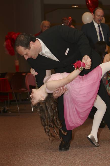 Andrew Sitrin dips his daughter, Emily, 7, while ballroom dancing ...