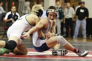 Foothill's Chad Orum attempts to escape the hold of Green Valley's Tony Simpson during the 130-pound championship match of the Sunrise Regional at Las Vegas High School on Saturday.
