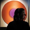 Angela Kallus calls her acrylic-on-canvas-on-panel circular works 
