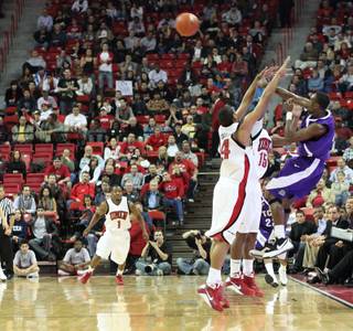 The UNLV defense presses TCU as UNLV took on the TCU Horned Frogs Tuesday at the Thomas & Mack Center in Las Vegas.