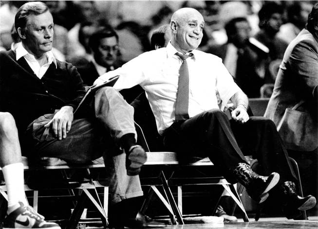 Former UNLV Men's Basketball coach Jerry Tarkanian relaxes on the bench as his Rebels take a big lead. 