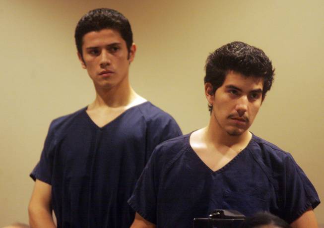 From right to left, Jose Delatorre and Juan Aguirre, then teens, stand as their case is discussed at Henderson Justice Court on Feb. 11, 2009.  Charged with the murder of Matthew Cox, a music teacher at Basic High School, Delatorre was set to go to trial in April, but is now considering a plea deal, according to his attorney.  Aguirre's trial is set for Sept. 10.  
