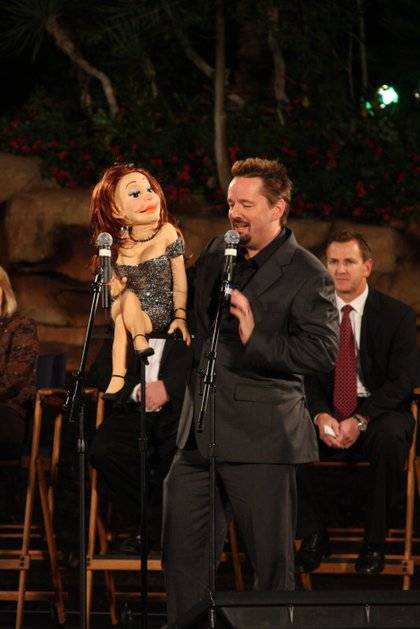 Terry Fator and one of his cast of thousands at the premiere of The Mirage volcano.