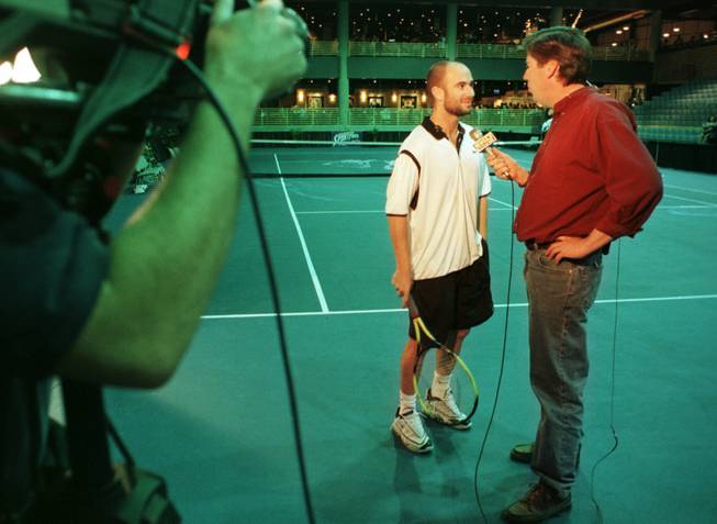 Ron Futrell interviews Andre Agassi during Futrell's days as a sports reporter at KTNV Channel 13.