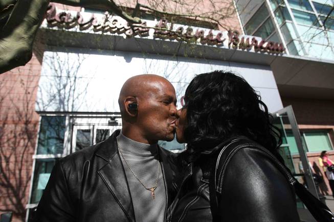 California residents Hollie McLeod, left, and Lydia Davis kiss after obtaining their marriage license at the Marriage License Bureau in downtown Las Vegas on Friday, Feb. 13, 2009. 