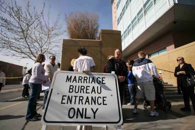 Couples line up outside the Marriage License Bureau at the Regional Justice Center in downtown Las Vegas on  the day before  Valentine's Day, 2009.