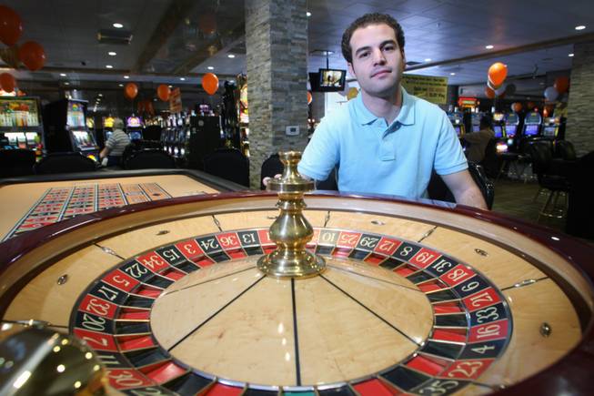 Michael Crandall, director of business affairs for The Siegel Group, is shown by a roulette wheel at the Gold Spike casino in downtown Las Vegas. 