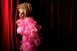 Female impersonator and magician Cashetta, who will performing his magic show at the Harmon Theatre, poses on stage Thursday, Feb. 12, 2008. 