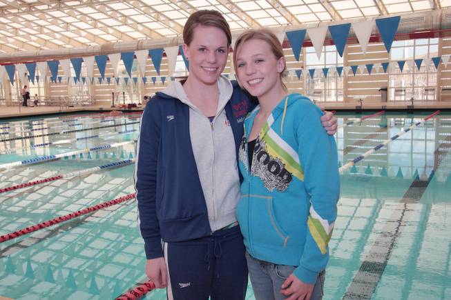 Green Valley High School senior swimmers Addie, right and Carlee Oswald pose for a photo.