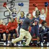 The Liberty High School bench including head coach, Chris Zunno, standing in middle, rejoice and celebrate after the go-ahead basket in the final seconds of the Patriots' 60-56 win over Valley High School in the Sunrise Regional quarterfinals on Thursday.