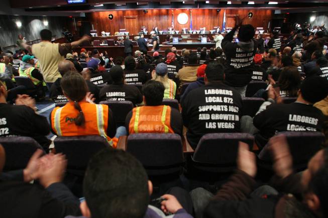 Members of Laborers Union Local 872 cheer a move last week by the Las Vegas City Council. The union members had packed the council chambers in support of Mayor Oscar Goodman's plan to build a multimillion-dollar city hall. If eventually approved, the construction project would likely employ many in the audience.