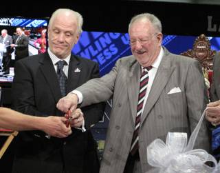 Las Vegas Mayor Oscar Goodman (right) and USBC Chief Operating Officer Kevin Dornberger cut the ribbon to open the USBC Open Championships at Cashman Center. 