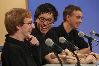 Palo Verde seniors, from left, Thomas Cole, Kian Ameli and Taylor Krabial react with laughter as the judges announced their team won the Varsity Quiz championship Monday afternoon at Vegas PBS studios. Palo Verde was victorious over Green Valley 165 to 125.