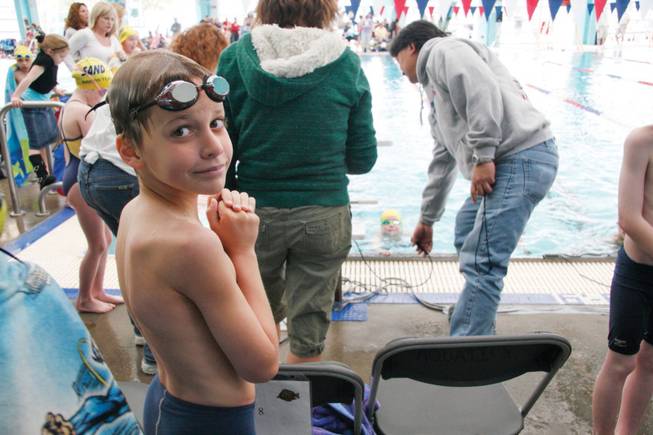 Boulder City-Henderson Heatwave swim team member Jake Hubel, 9, waits for his round in the water during the Desert Section championships at the Dula Center community pool.