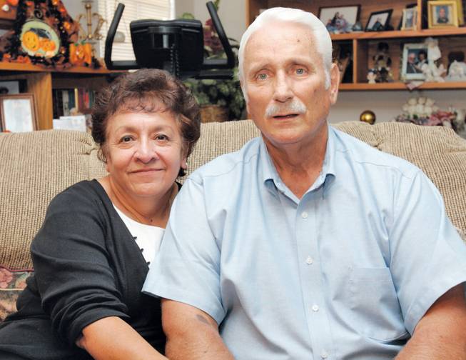 Former Basic and Green Valley football coach Lanny Littlefield, who has been diagnosed with non-alcoholic cirrhosis of the liver, and his wife, Gloria, stand in their home in Henderson on Oct. 5, 2006.