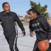 Budweiser Hawkins III, right, a junior guard for Trinity Christian and his father Budweiser Hawkins II play basketball together at Desert Bloom Park.
