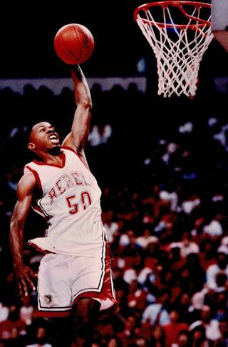 UNLV standout Greg Anthony throws down a dunk for the Rebels. Anthony helped lead the Rebels to a National Championship in 1990. 