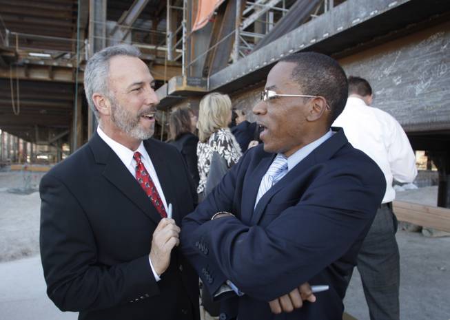 Las Vegas City Councilman Steve Wolfson, left, and Clark County Commissioner Lawrence Weekly joke with each other during a topping-off ceremony for the Smith Center for the Performing Arts in downtown Las Vegas Thursday, February 25, 2010.