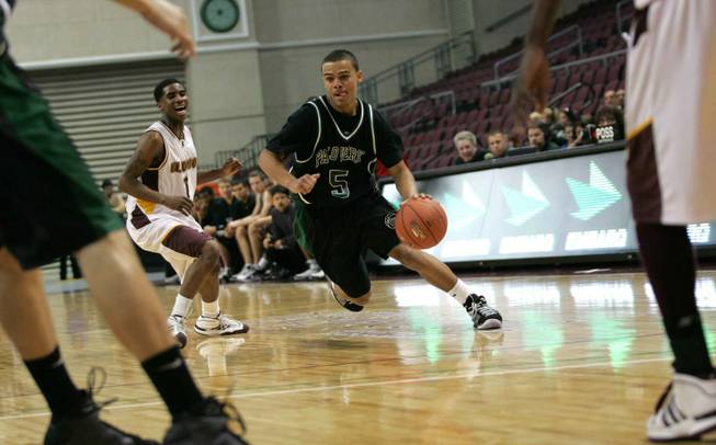 Palo Verde's Davion Pearson (5) dribbles up court against Eldorado on Thursday in the 4A state semifinals at the Orleans Arena. The Panthers won 68-60.
