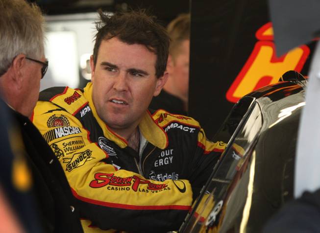 Las Vegas native Brendan Gaughan, the son of South Point casino owner Michael Gaughan, is shown in his garage as he prepares a backup car after hitting the wall during practice at the Las Vegas Motor Speedway on Friday.