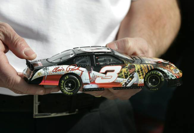 The "Earnhardt and Elvis" race car, a die-cast collectible through Motorsports Authentics, is displayed at the unveiling of a Dale Earnhardt and Elvis Presley-themed race car at the Las Vegas Motor Speedway Friday.